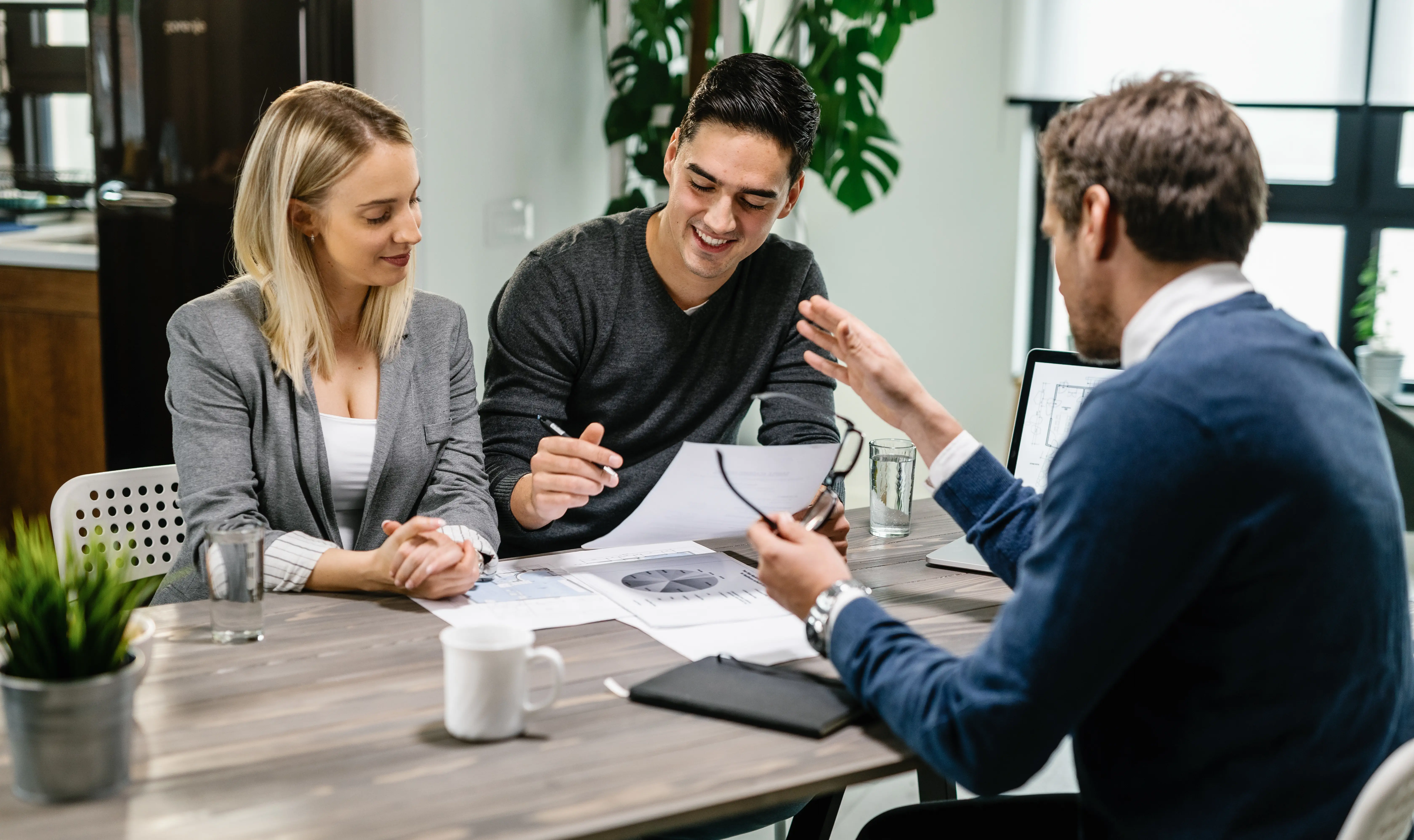 Attorney reviewing legal documents with a client in an office